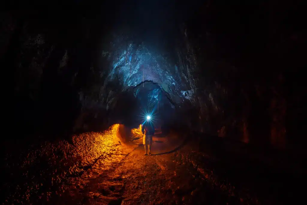 Man Walking in Thurston Lava Tube Hawaii Volcanoes National Park Big Island