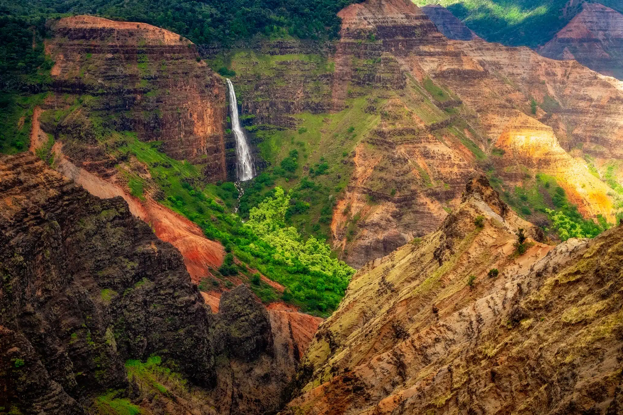 Waipo'o Falls is a Waterfall located in the city of Kekaha on Kauai, Hawaii